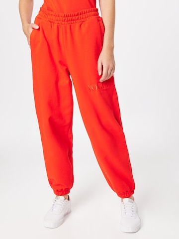 PUMA Zwężane Spodnie w kolorze pomarańczowy: przód