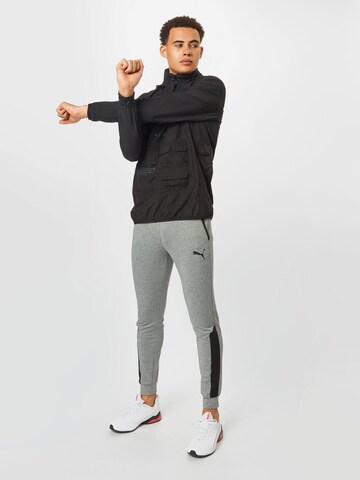 PUMA Športna jakna 'First Mile' | črna barva