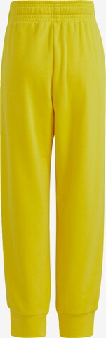 ADIDAS SPORTSWEAR Tapered Workout Pants 'LEGO' in Yellow