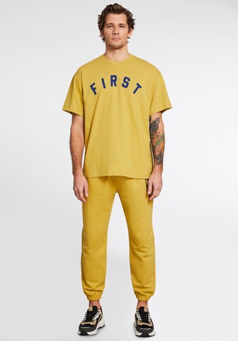 Grimelange T-Shirt 'WHIST' in Gelb