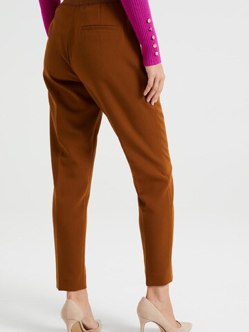 WE Fashion Slim fit Trousers with creases in Brown