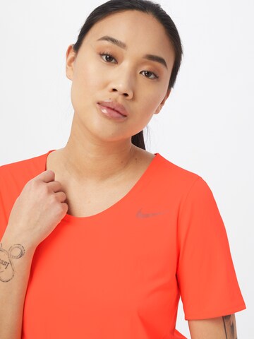 NIKE Performance shirt 'City Sleek' in Orange