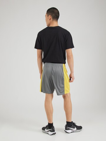 UNDER ARMOUR Regular Sports trousers 'Challenger' in Green