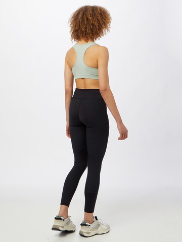 Skinny Pantaloni sportivi 'Studio Porcelain' di PUMA in nero