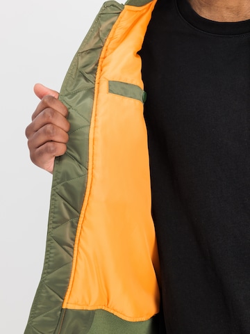 ALPHA INDUSTRIES Between-Season Jacket 'MA-1 Black Devils' in Green: front