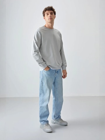 Sweat-shirt Tommy Life en gris