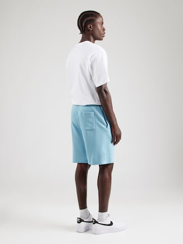Nike Sportswear Loosefit Housut 'CLUB ALUMNI' värissä sininen