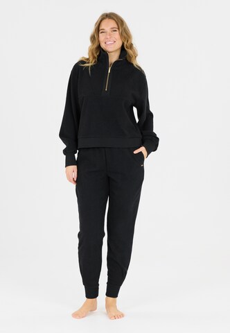 Athlecia Regular Sports trousers in Black