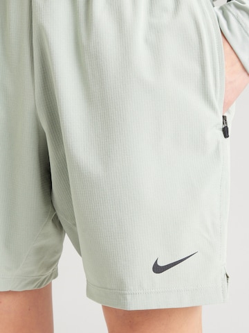 regular Pantaloni sportivi 'FLEX REP 4.0' di NIKE in verde