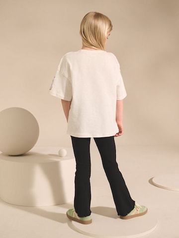 T-Shirt Next en blanc