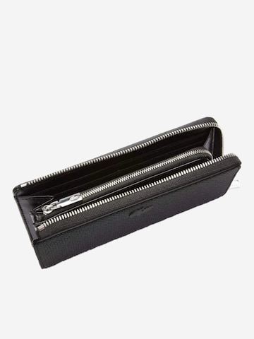 LACOSTE - Cartera 'Lacoste Compagnon cuir piqué Chantaco' en negro