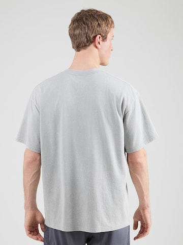 T-Shirt fonctionnel UNDER ARMOUR en gris