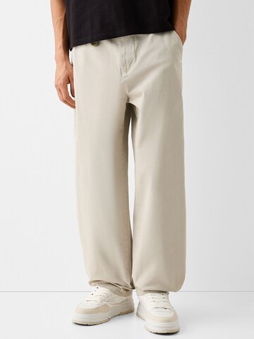 Bershka Wide leg Trousers in Beige: front