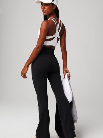 Fabletics Regular Hose `OASIS HIGH-WAISTED KICK FLARE` in Schwarz