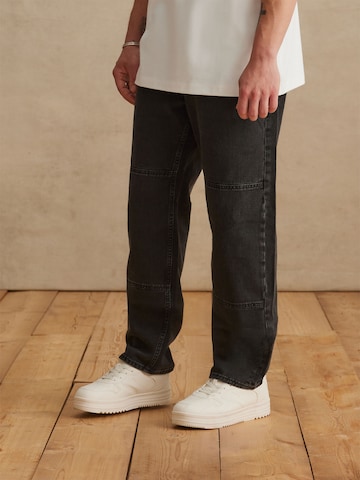 DAN FOX APPAREL Tapered Jeans 'Lucien' in Black: front