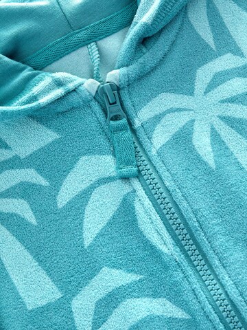 Next - Mono en azul