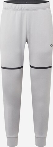 OAKLEY - Tapered Pantalón deportivo en gris: frente