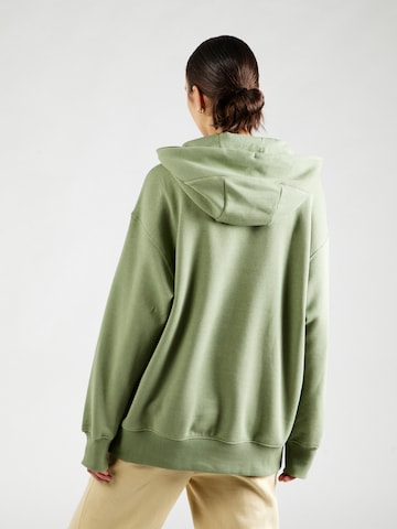 Nike SportswearSweater majica 'Swoosh' - zelena boja
