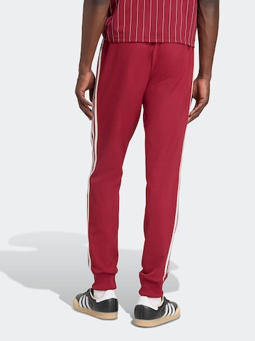 Tapered Pantaloni sport 'FC Arsenal Terrace Icons' de la ADIDAS PERFORMANCE pe roșu
