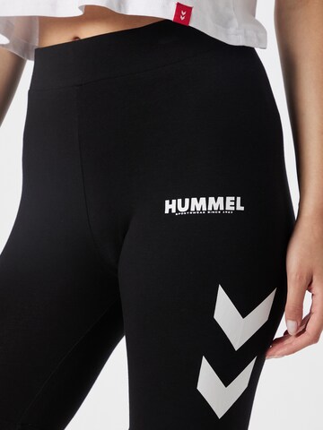 Skinny Pantaloni sportivi 'LEGACY' di Hummel in nero