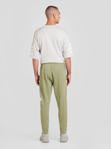 Tapered Pantaloni sportivi di ADIDAS SPORTSWEAR in verde