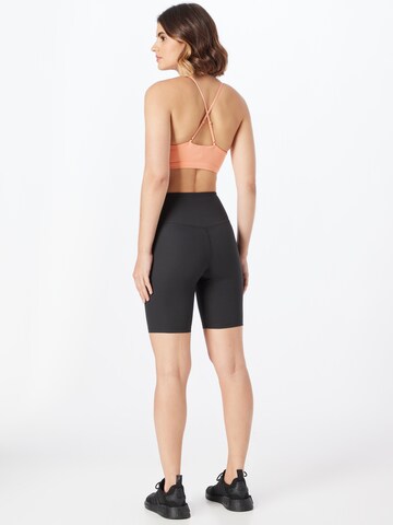 Skinny Pantaloni sportivi di Girlfriend Collective in nero