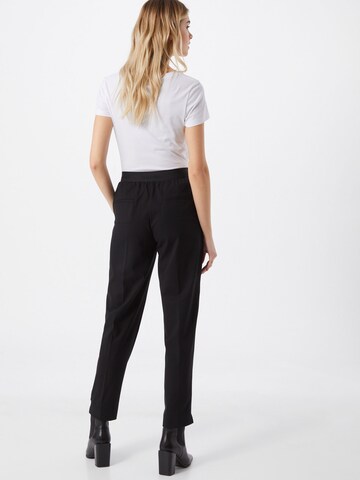 Calvin Klein Tapered Παντελόνι πλισέ σε μαύρο