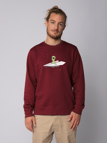 Watapparel Sweatshirt 'Alien on a paper plane' in Rot: Vorderseite