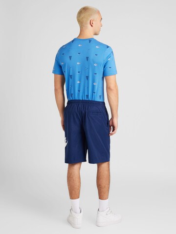 Nike Sportswear Loose fit Trousers 'CLUB' in Blue