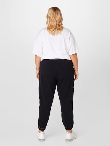 Nike Sportswear Tapered Workout Pants in Black