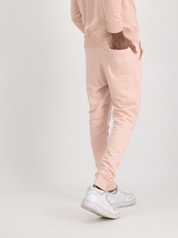 ALPHA INDUSTRIES Tapered Broek 'X-Fit' in Oranje