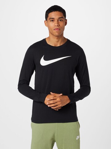 Nike Sportswear - Camiseta en negro: frente