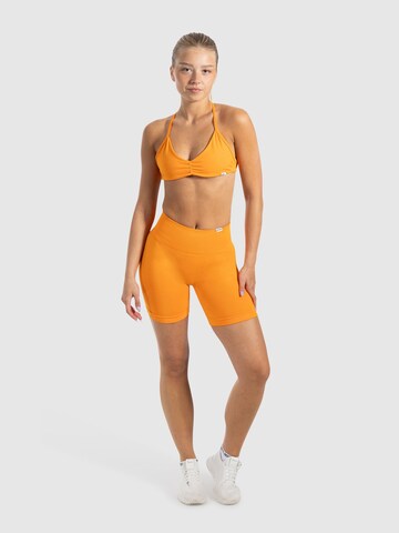 Smilodox Slimfit Sportbroek ' Scrunch Edina ' in Oranje