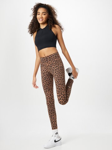 NIKE Skinny Workout Pants in Brown