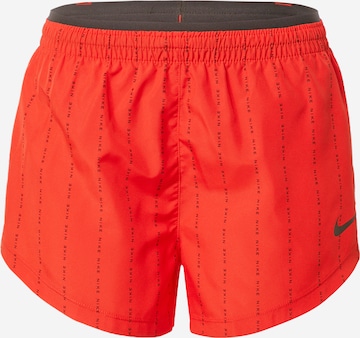 NIKE Sports trousers in Red: front