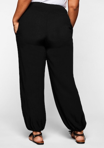 SHEEGO - Tapered Pantalón en negro