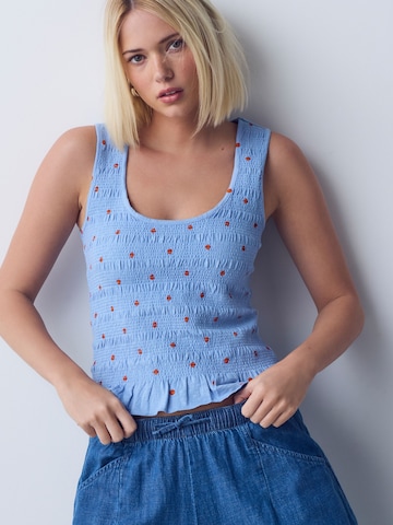 Haut Next en bleu : devant