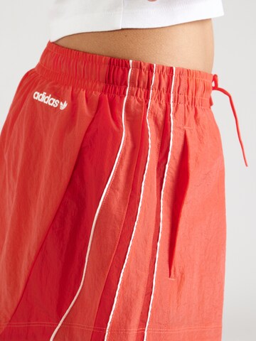 ADIDAS ORIGINALS Loose fit Trousers 'SANTIAGO' in Red