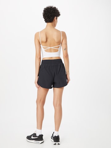 UNDER ARMOUR Regular Workout Pants 'Flex' in Black
