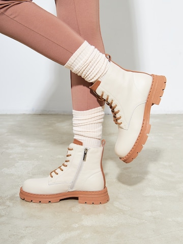 CESARE GASPARI Lace-Up Ankle Boots in Beige