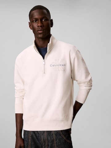 Sweat-shirt Calvin Klein Jeans en beige : devant