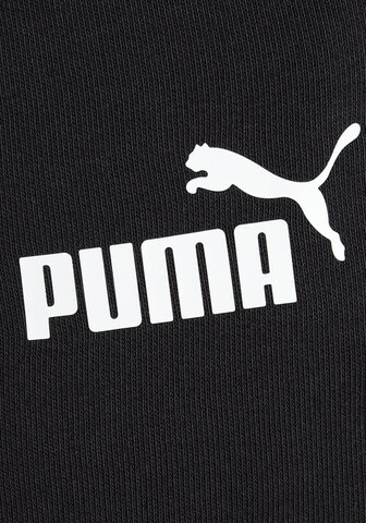 PUMA - Tapered Pantalón deportivo en negro