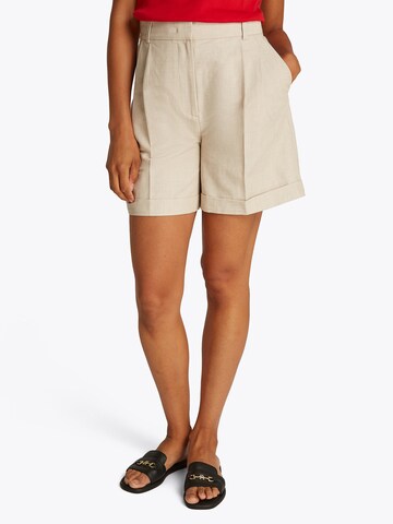 TOMMY HILFIGER Regular Chino trousers in Beige: front