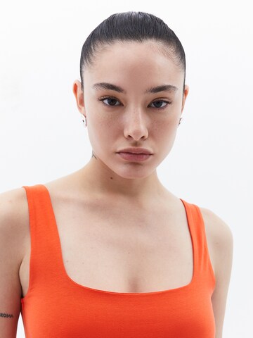 OXXO Top in Oranje
