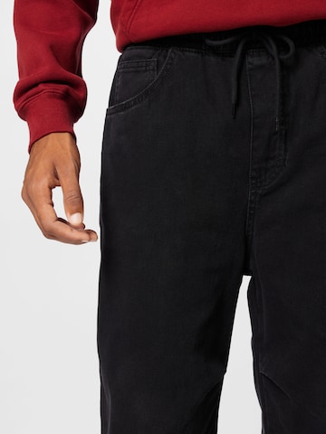 ABOUT YOU Tapered Jeans 'Harun' in Zwart