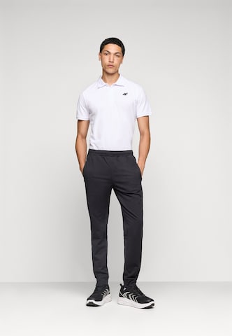 Tapered Pantaloni sportivi 'FNK' di 4F in nero