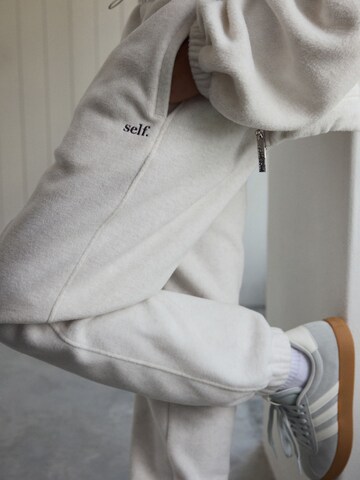 self. Tapered Pants in Beige