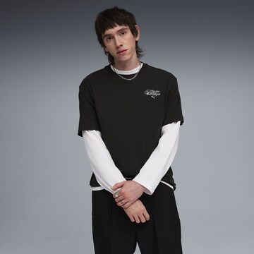 PUMA Shirt 'Slogan' in Zwart: voorkant