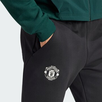ADIDAS SPORTSWEAR Tapered Workout Pants 'Manchester United Designed for Gameday' in Black