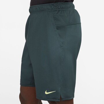 NIKE Regular Workout Pants in Blue